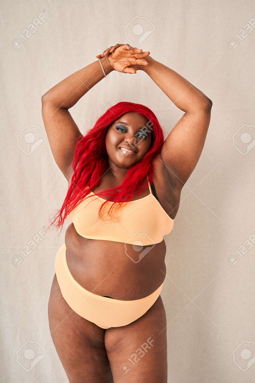 Happy Chubby Woman Posing With Hands Raised Up, Showing Her Smooth Armpits  Фотография, картинки, изображения и сток-фотография без роялти. Image  181705222