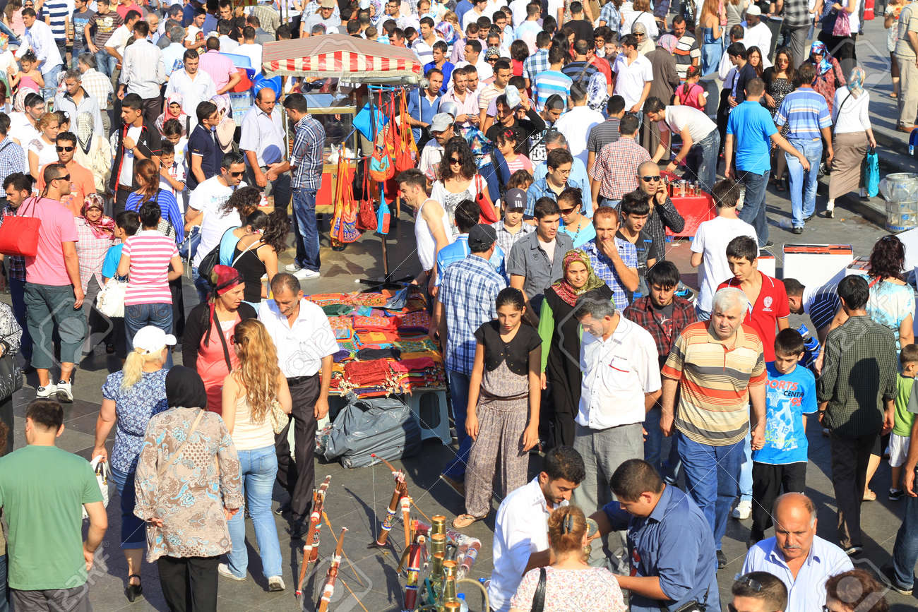 ISTANBUL - AUGUST 31: Crowd of people enjoy themselves at Eminonu Square during Lesser Bairam on August 31, 2010 in Istanbul, Turkey. Eminonu is the major trade and strolling centre in the city. - 10435296 ISTANBUL - AUGUST 31: Crowd of people enjoy themselves at Eminonu Square during Lesser Bairam on August 31, 2010 in Istanbul, Turkey. Eminonu is the major trade and strolling centre in the city. - 10435296