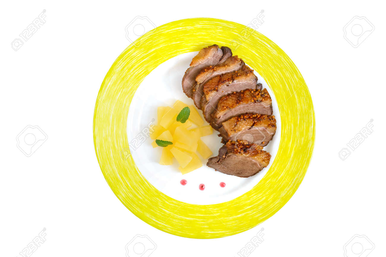 Duck Breast Magret With Pieces Of Pineapple On A Plate Isolated
