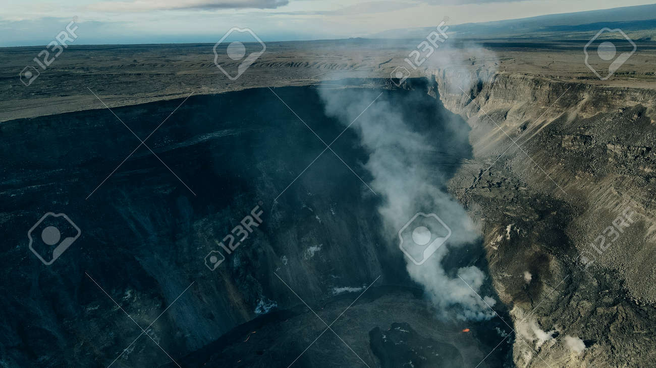 Helicopter over Kilauea Volcano in Hawaii Volcanoes National Park on the Big Island. - 169776278 Helicopter over Kilauea Volcano in Hawaii Volcanoes National Park on the Big Island. - 169776278