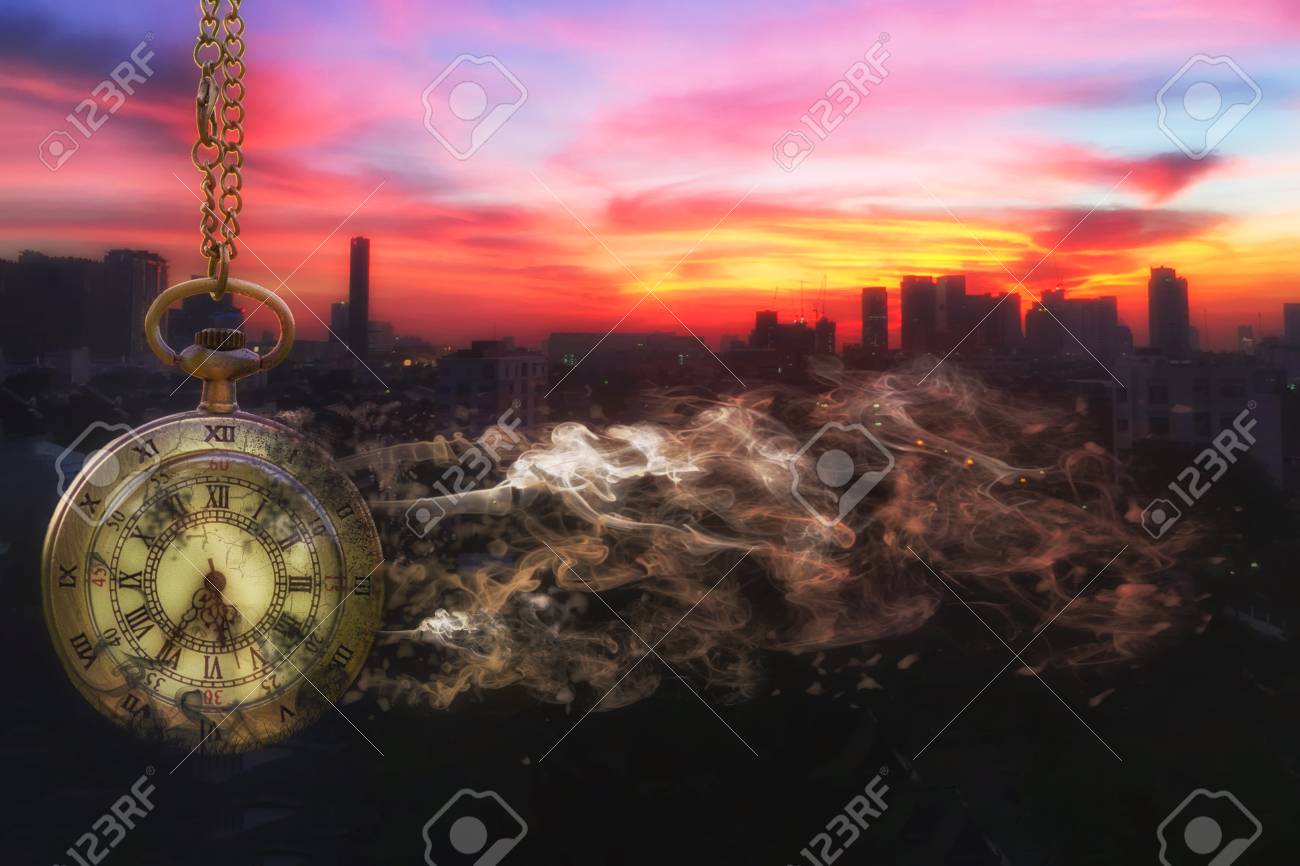 Pocket watch is disintegrating with city scape background at last sunlight (Concept of wasting time) - 69567949 Pocket watch is disintegrating with city scape background at last sunlight (Concept of wasting time) - 69567949