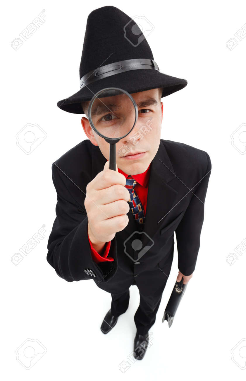 虫眼鏡を通して見上げるブリーフケースと若い探偵 の写真素材 画像素材 Image 1065