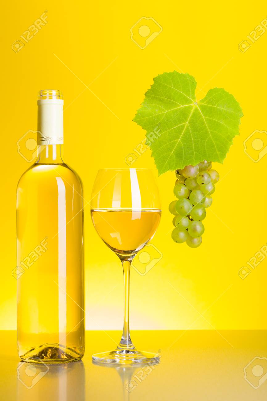Download Bottle And Glass Of White Wine With Grape Cluster On Yellow Stock Photo Picture And Royalty Free Image Image 23236034 Yellowimages Mockups