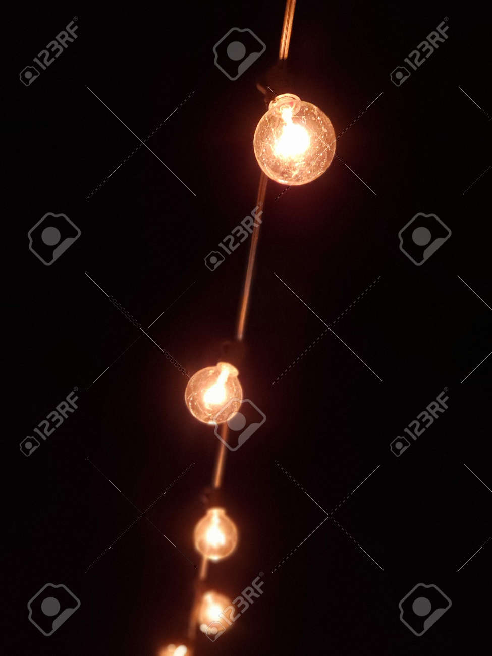 String Of Outdoor Light Bulbs At Night