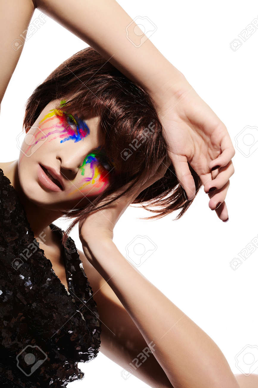 Fashion Model With Short Dark Fluffy Hair And Colorful Make Up