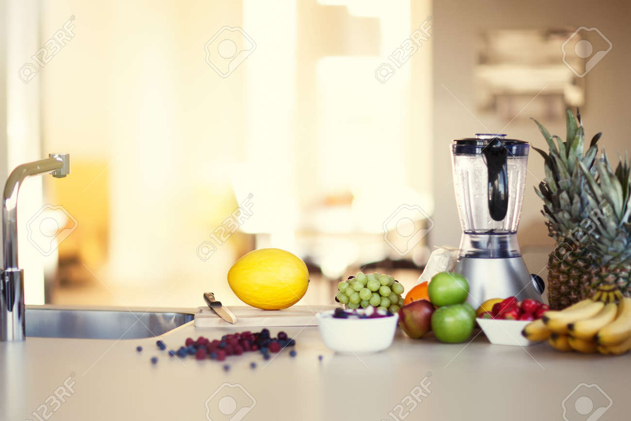 Ingredients for making smoothie in sunny kitchen. Variety of berries and fruit. - 49504256 Ingredients for making smoothie in sunny kitchen. Variety of berries and fruit. - 49504256