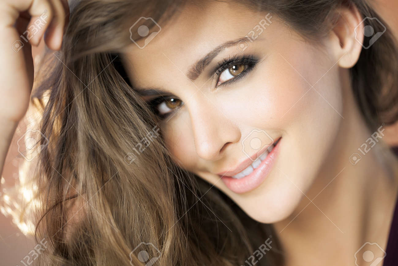 A closeup portrait of a young happy woman with beautiful eyes. Fashion and beauty concept in studio. - 50928221 A closeup portrait of a young happy woman with beautiful eyes. Fashion and beauty concept in studio. - 50928221