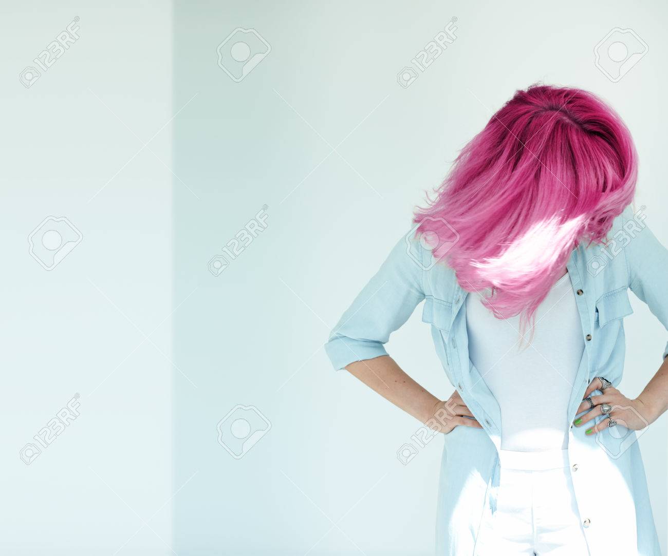 Motion shot of woman's hair. Dyed hair in daylight concept. Beautiful woman with copyspace. - 58629563 Motion shot of woman's hair. Dyed hair in daylight concept. Beautiful woman with copyspace. - 58629563
