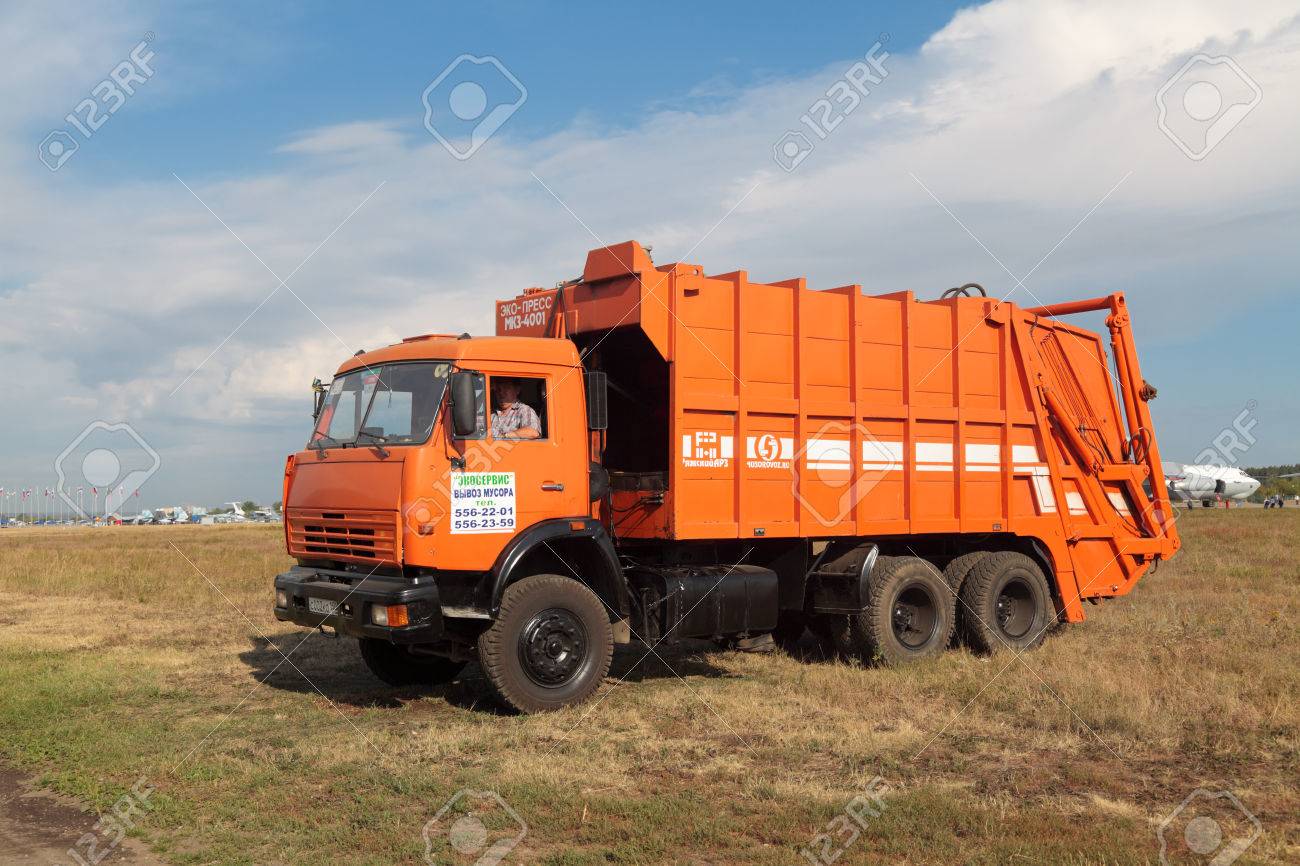 Orange Garbage Truck In The Field Stock Photo Picture And Royalty Free Image Image 29773658
