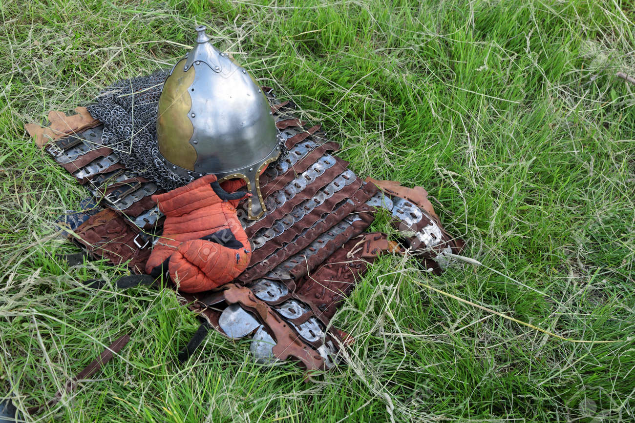 Medieval Military Armor Lying On The Grass Stock Photo, Picture And Royalty  Free Image. Image 35176277.
