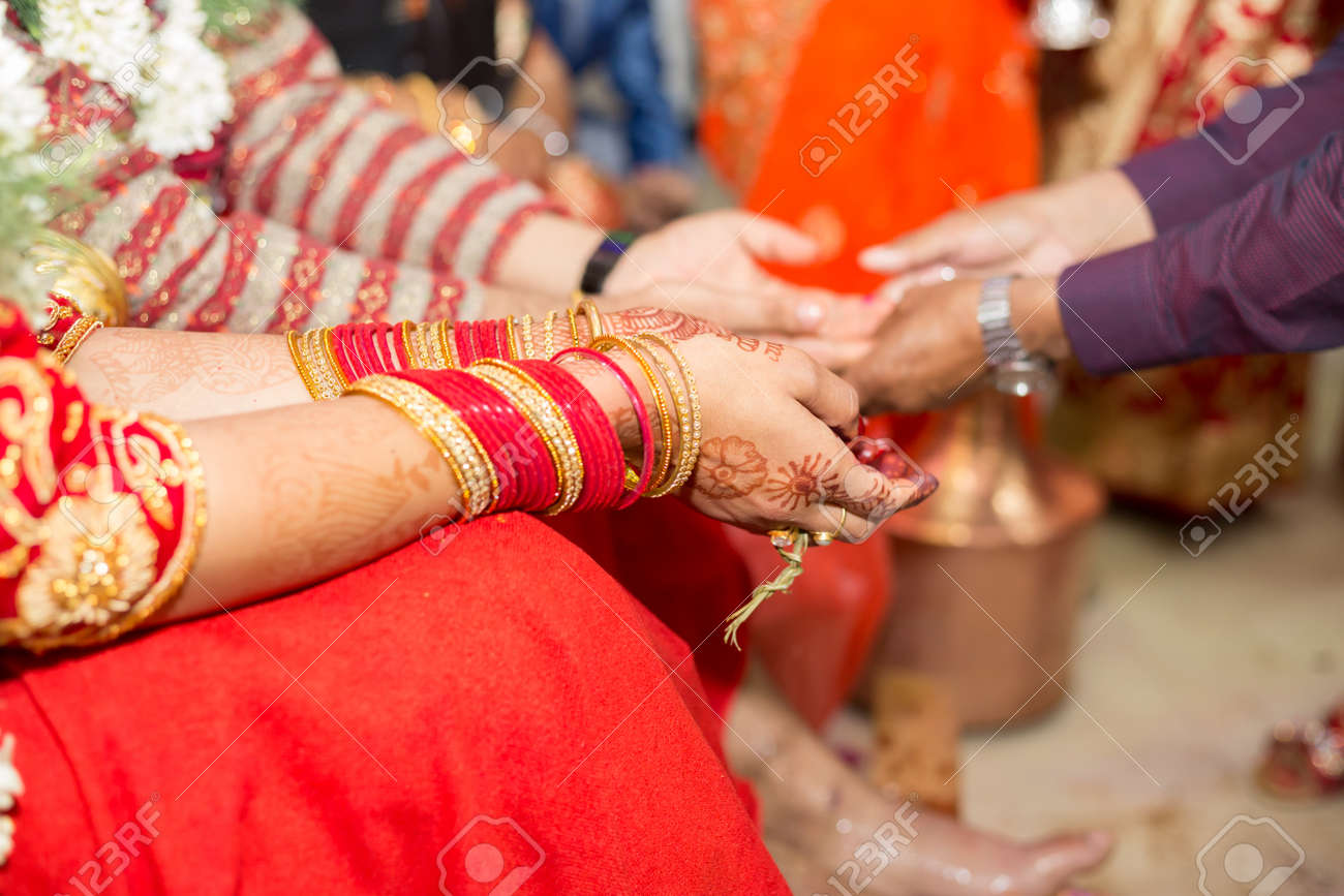 Hindu Nepali Bride and groom's Hands on the wedding day. - 101264893 Hindu Nepali Bride and groom's Hands on the wedding day. - 101264893