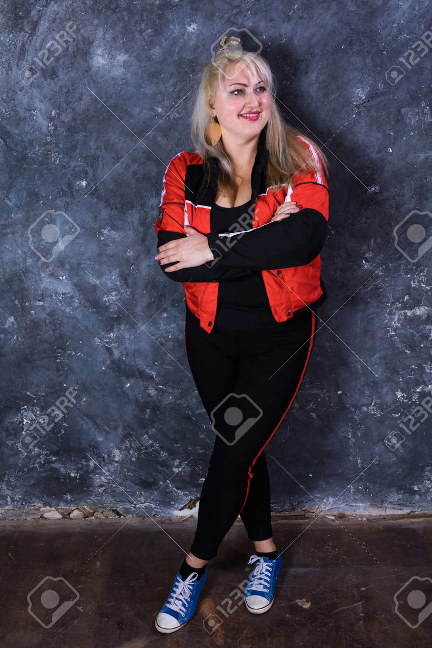 Attractive plump woman dressed in sport style casual - 158936651 Attractive plump woman dressed in sport style casual - 158936651