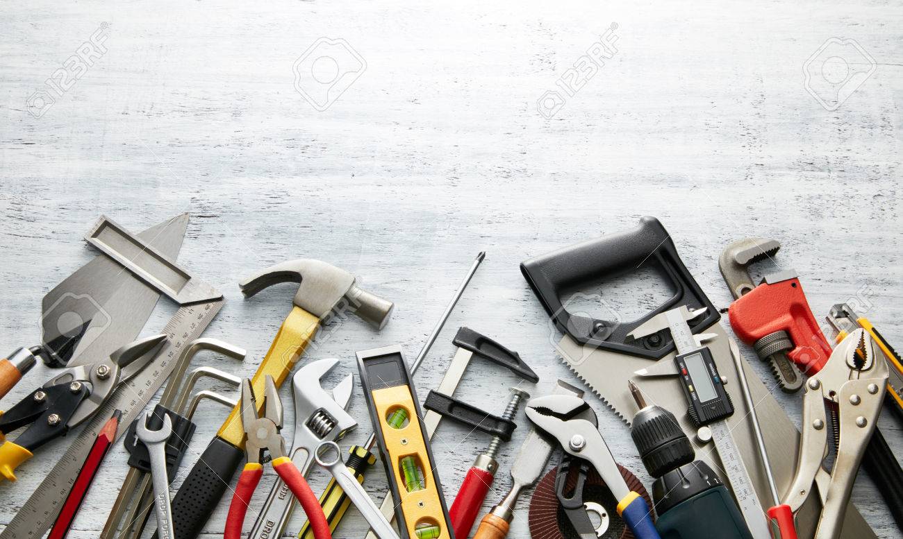 variety of tools on white textured background with copy space - 44218555 variety of tools on white textured background with copy space - 44218555