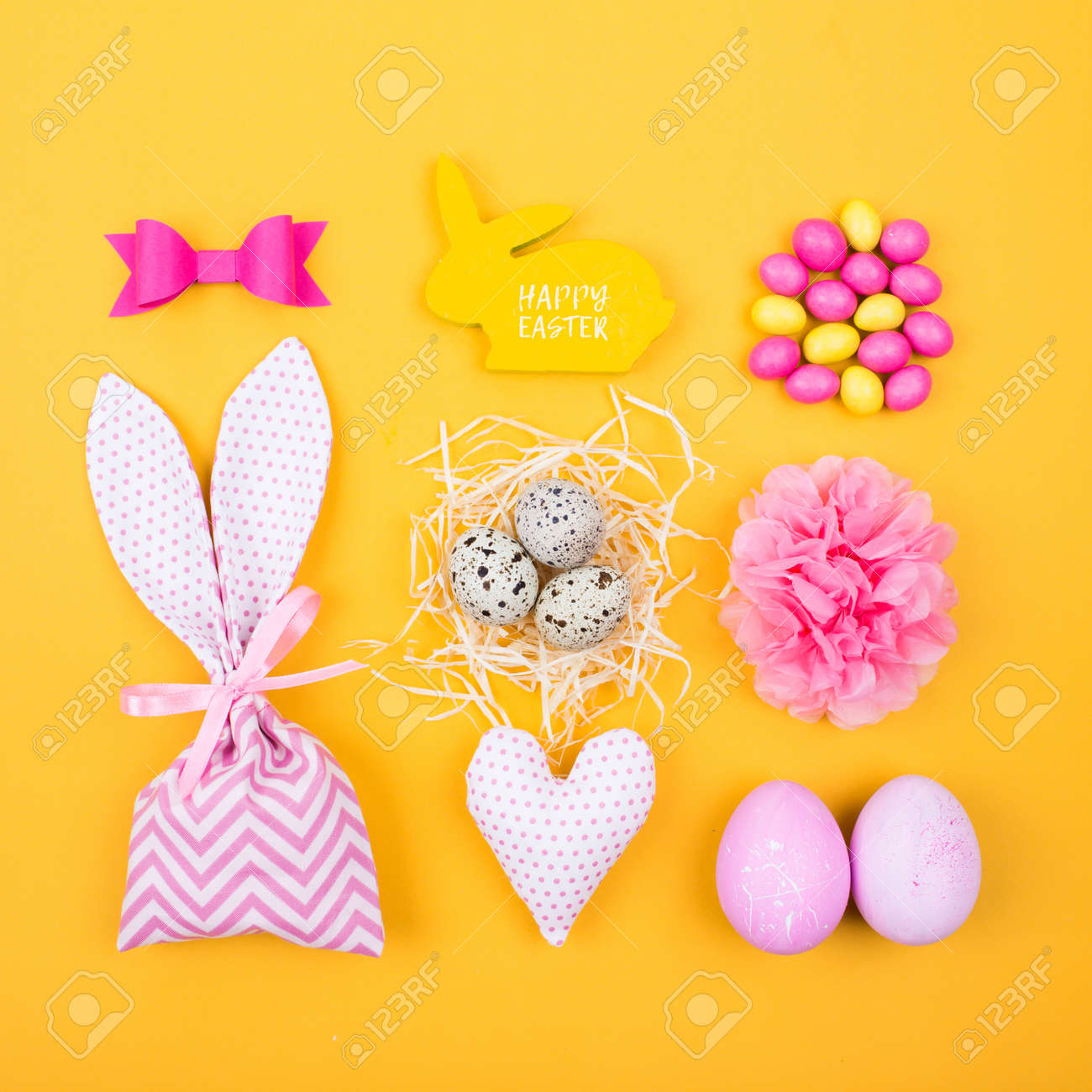 flat lay stylish set pink and yellow easter eggs fabric bunny