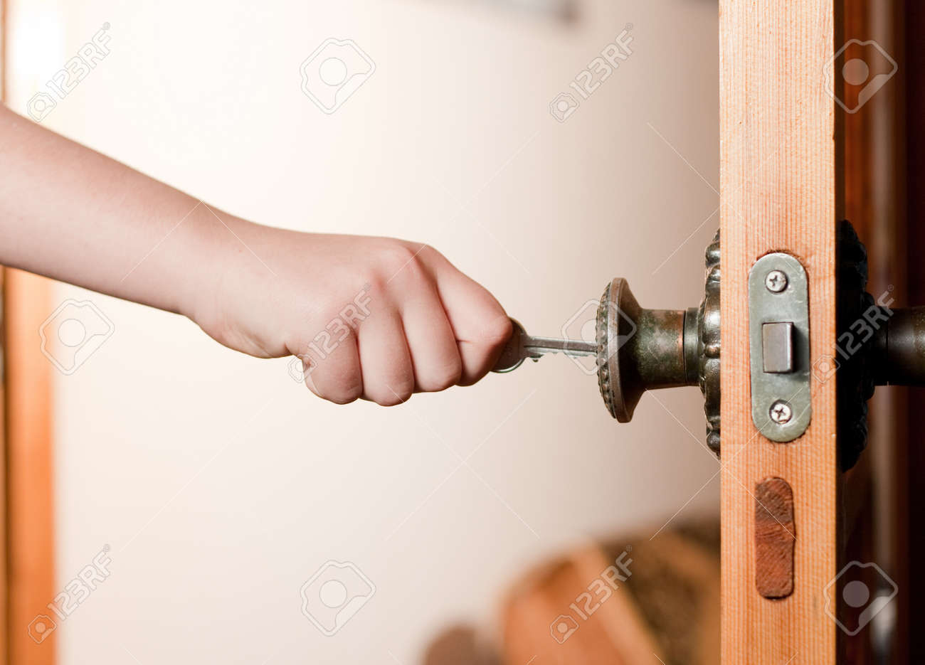 Locking Up Or Unlocking Door With Key In Hand