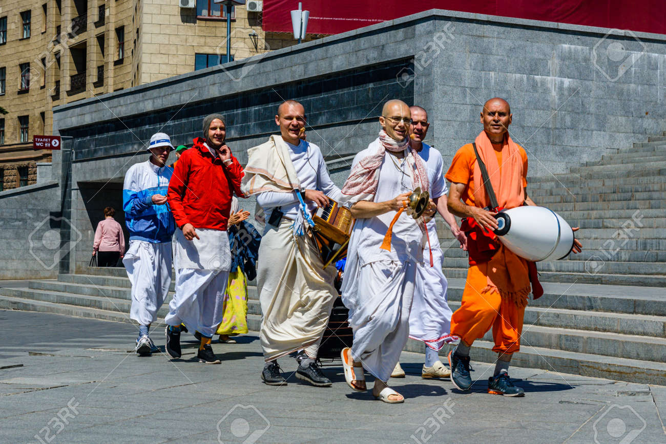 Hare Krishna singings march through the street Stock Photo - Alamy