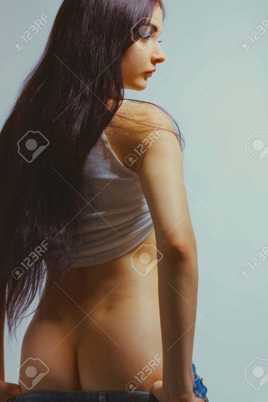 Young Pretty Woman Undressing Over Blue Background Stock Photo, Picture and  Royalty Free Image. Image 71642240.