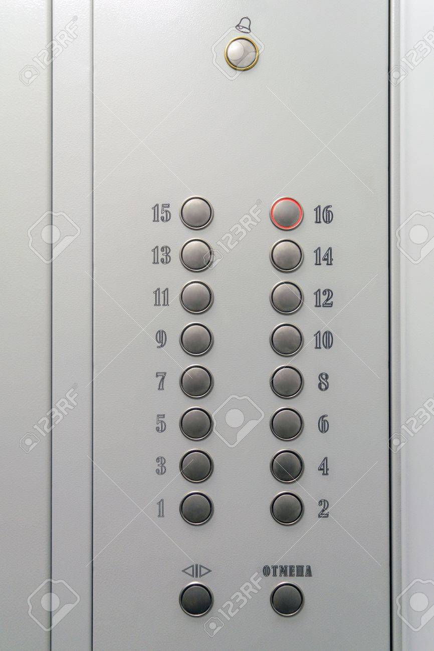metal elevator control panel with round buttons with numbers stock