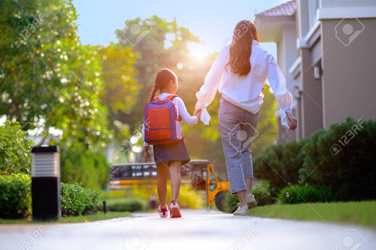 mother on the way sending daughter girl to school bus in the first day of study learning - 133881349 mother on the way sending daughter girl to school bus in the first day of study learning - 133881349