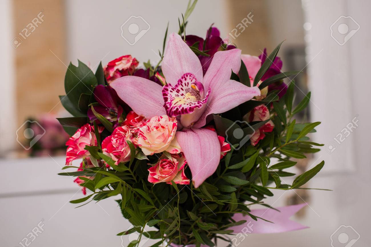 stock photo wedding flowers wedding bouquet of red and pink peach yellow roses and blue violet purple orchid bouquet of blue purple purple flowers