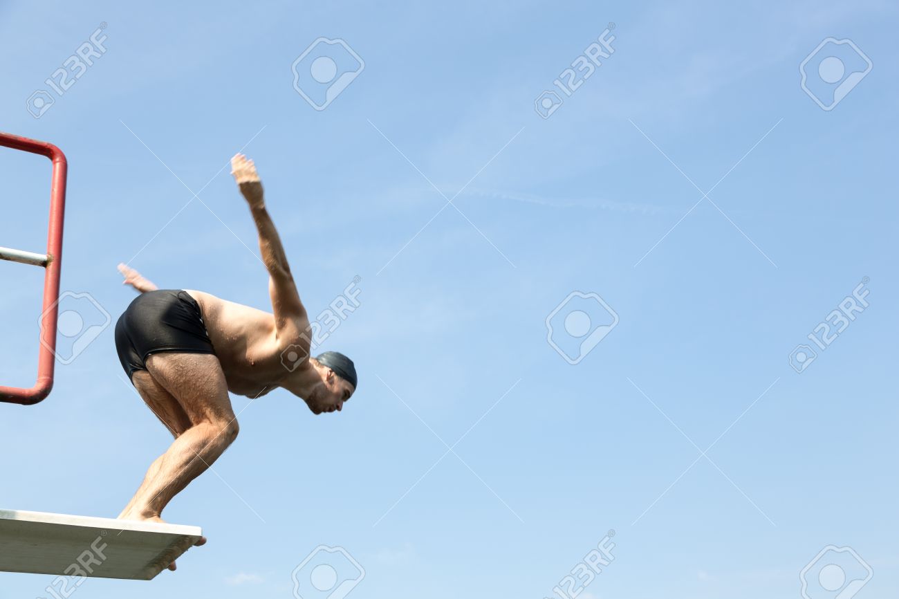 Public Swimming Pools With Diving Boards man jumping off diving board at a public swimming pool stock photo Public Swimming Pools With Diving Boards man jumping off diving board at a public swimming pool stock photo