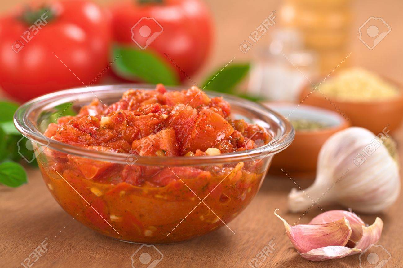 glass bowl of fresh homemade tomato sauce for pizza made of fresh