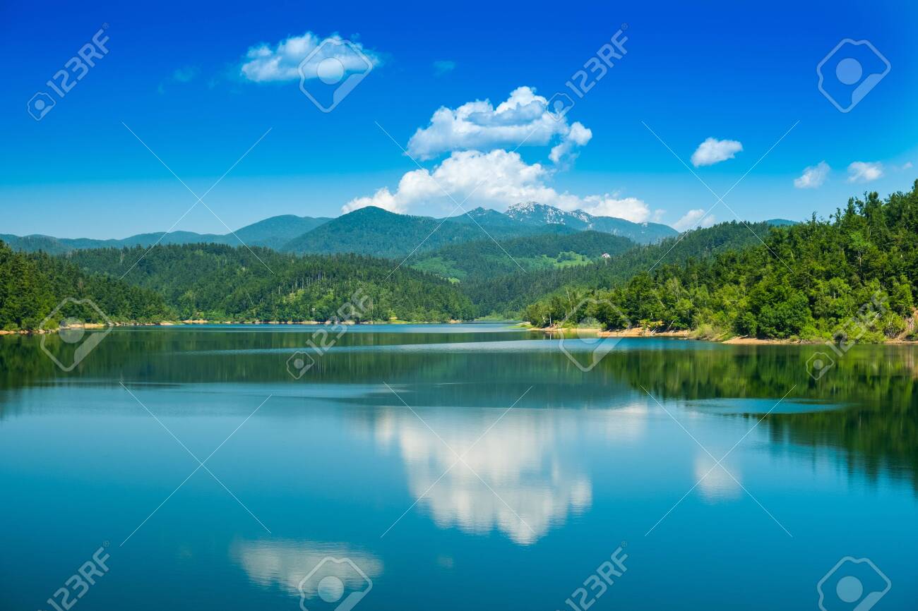 Croatia, beautiful lake in Gorski kotar, Lokve, Risnjak mountain in background, reflection in watter - 128657957 Croatia, beautiful lake in Gorski kotar, Lokve, Risnjak mountain in background, reflection in watter - 128657957