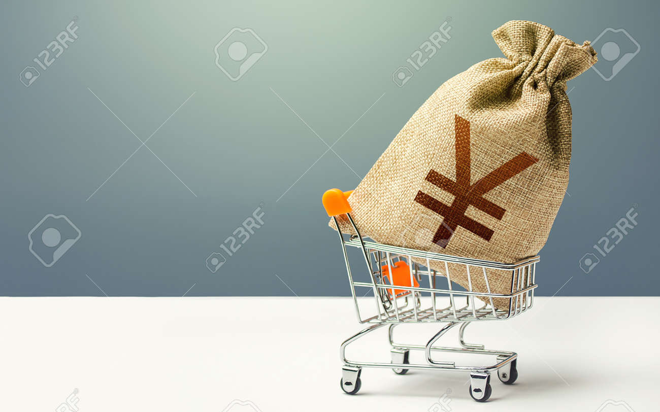 Yuan Yen money bag in a shopping cart. Profits and super profits. Minimum living wage. Business and trade concept. Public budgeting. Economic bubbles. Loans, microloans. Consumer basket. - 159715425 Yuan Yen money bag in a shopping cart. Profits and super profits. Minimum living wage. Business and trade concept. Public budgeting. Economic bubbles. Loans, microloans. Consumer basket. - 159715425