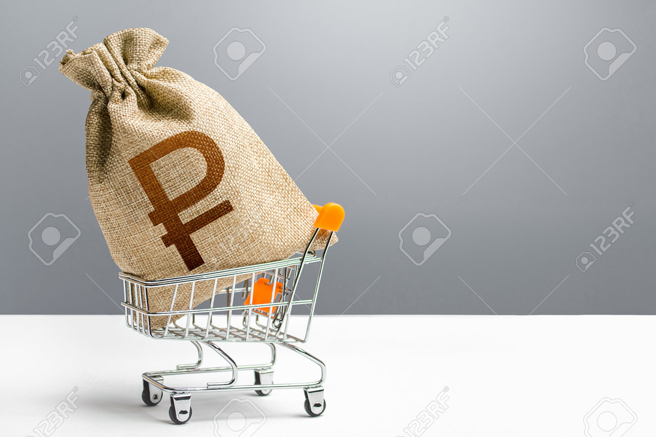 Russian ruble money bag in a shopping cart. Public budgeting. Profits and super profits. Economic bubbles. Loans, microloans. Consumer basket. Business and trade concept. Minimum living wage. - 162744862 Russian ruble money bag in a shopping cart. Public budgeting. Profits and super profits. Economic bubbles. Loans, microloans. Consumer basket. Business and trade concept. Minimum living wage. - 162744862