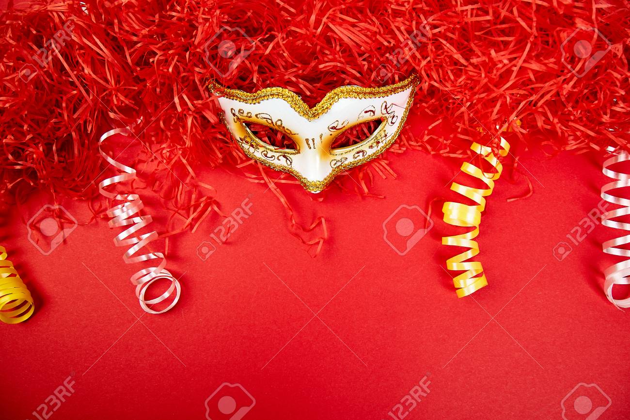 Download Yellow And White Carnival Mask On Red Background Top View Image Stock Photo Picture And Royalty Free Image Image 112631014 PSD Mockup Templates