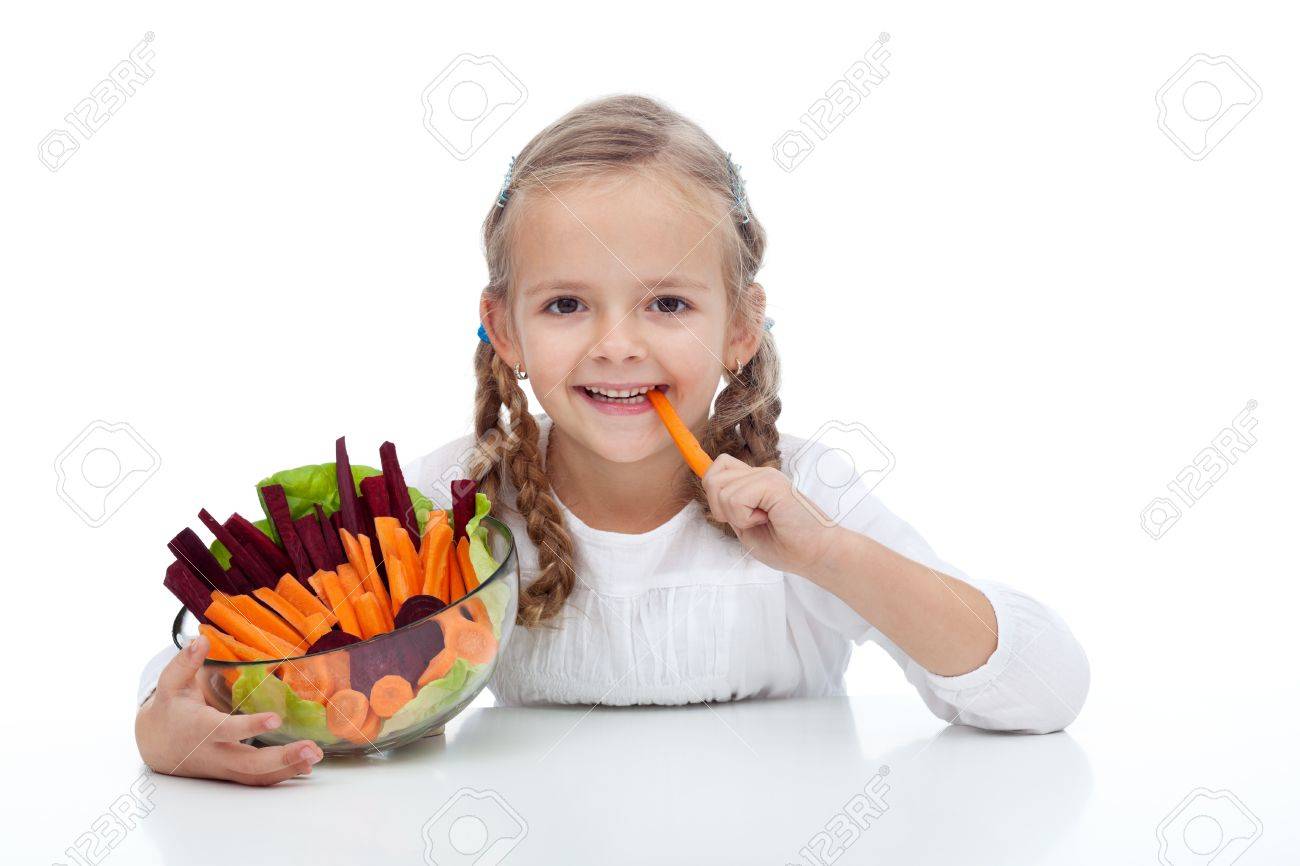 Little Girl Munching On A Carrot Stick Holding Bowl Of Vegetables Stock  Photo, Picture and Royalty Free Image. Image 11411207.