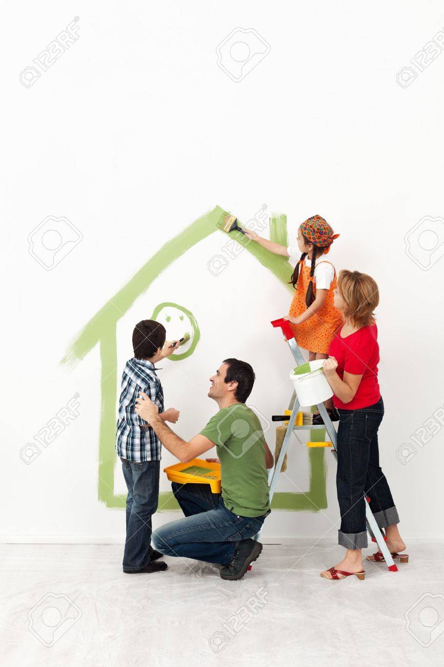 Happy family painting their home together with the kids - 18162511 Happy family painting their home together with the kids - 18162511