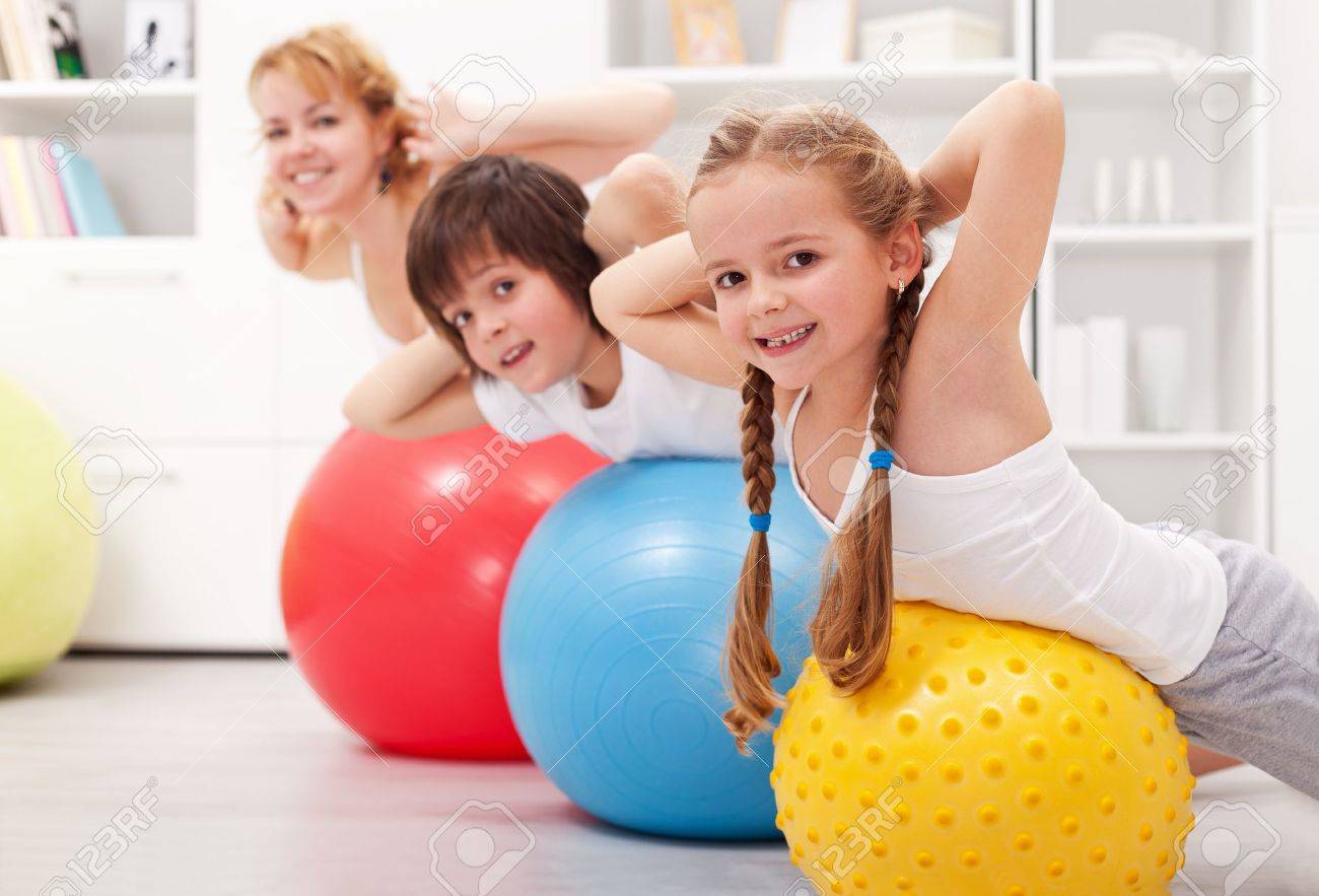 Kids exercising with their mother at home - 18919122 Kids exercising with their mother at home - 18919122