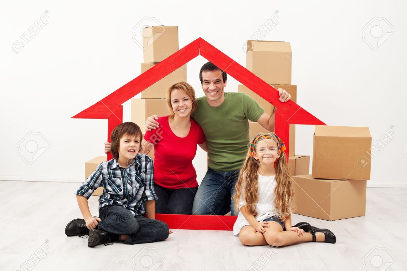 Happy family with kids moving into a new home - sitting with cardboard boxes - 19505419 Happy family with kids moving into a new home - sitting with cardboard boxes - 19505419