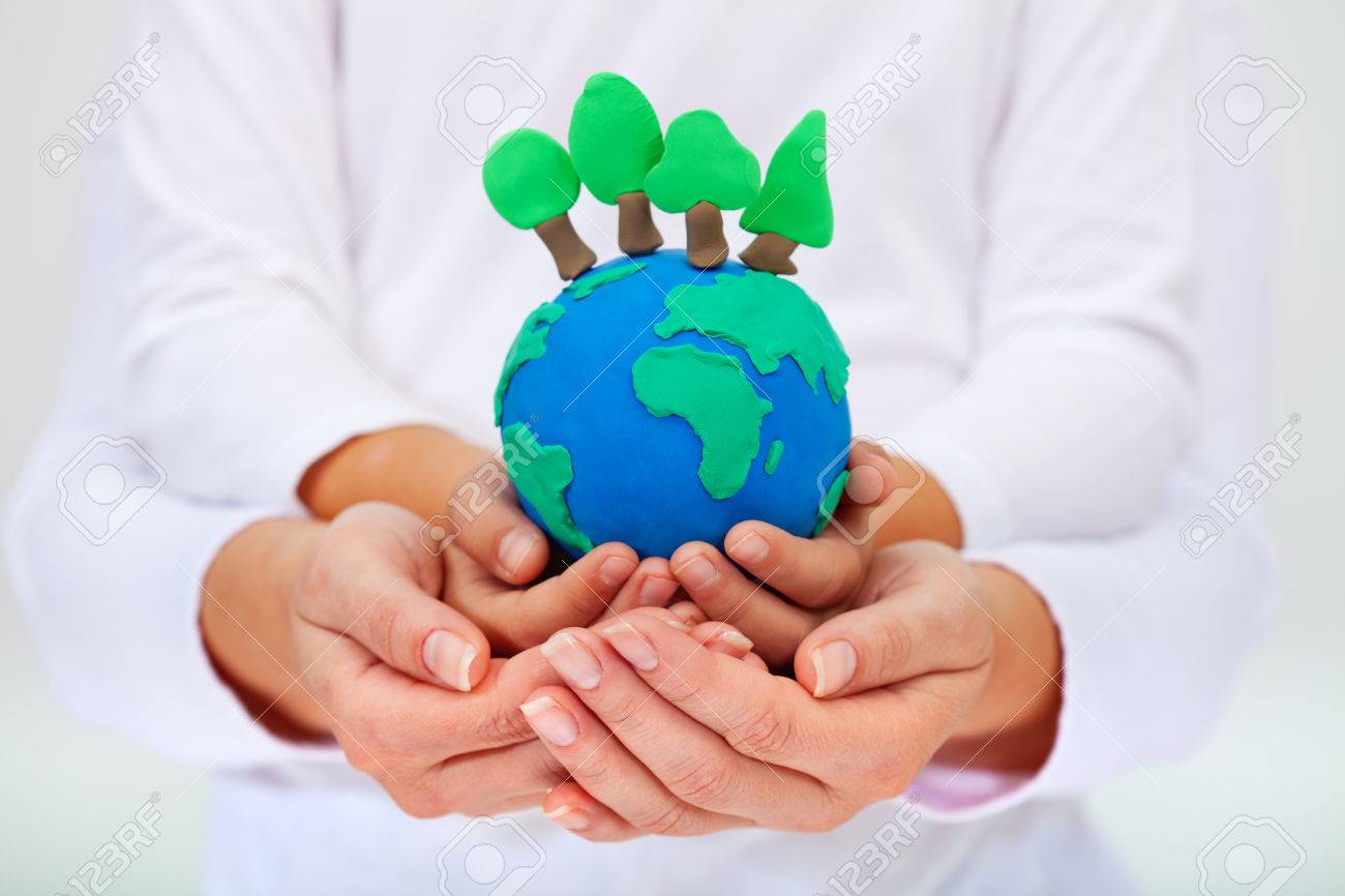 Protecting Our Environment Concept - Clay Earth With Trees Held By ...