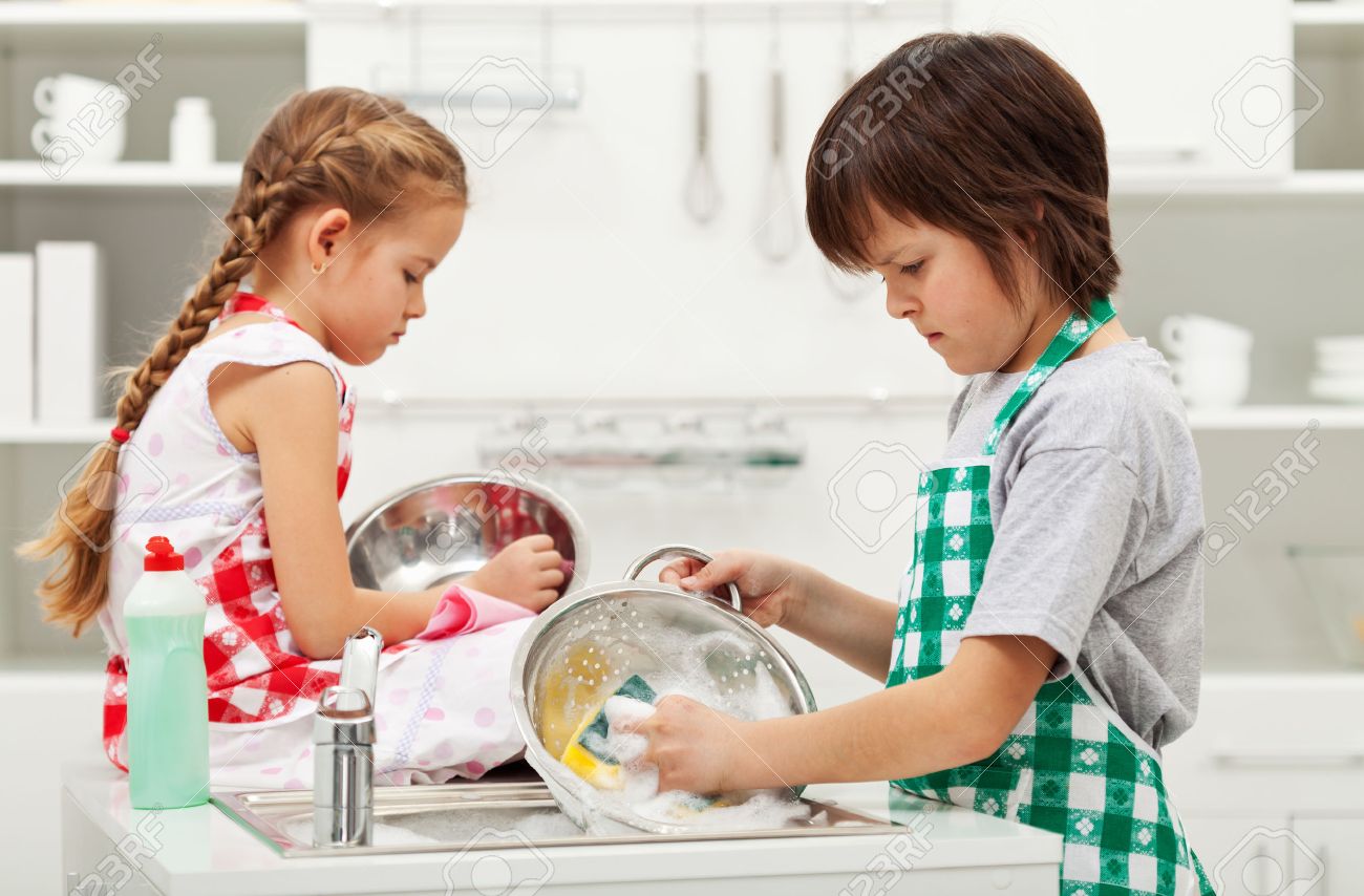 Grumpy kids doing home chores on parents order - washing dishes - 26398332 Grumpy kids doing home chores on parents order - washing dishes - 26398332