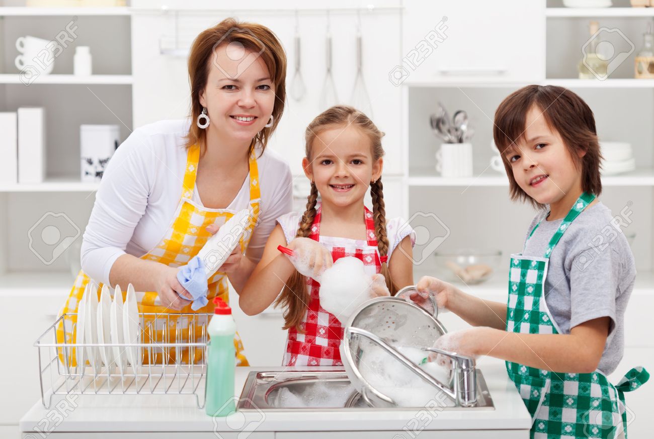 Kids helping their mother in the kitchen - washing the dishes - 31584624 Kids helping their mother in the kitchen - washing the dishes - 31584624