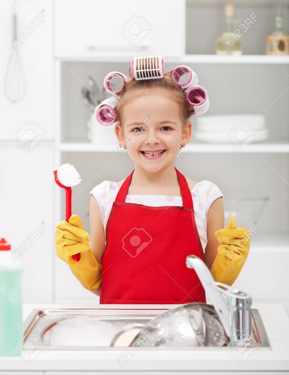 Happy housekeeping fairy - washing the dishes with a grin - 32127320 Happy housekeeping fairy - washing the dishes with a grin - 32127320