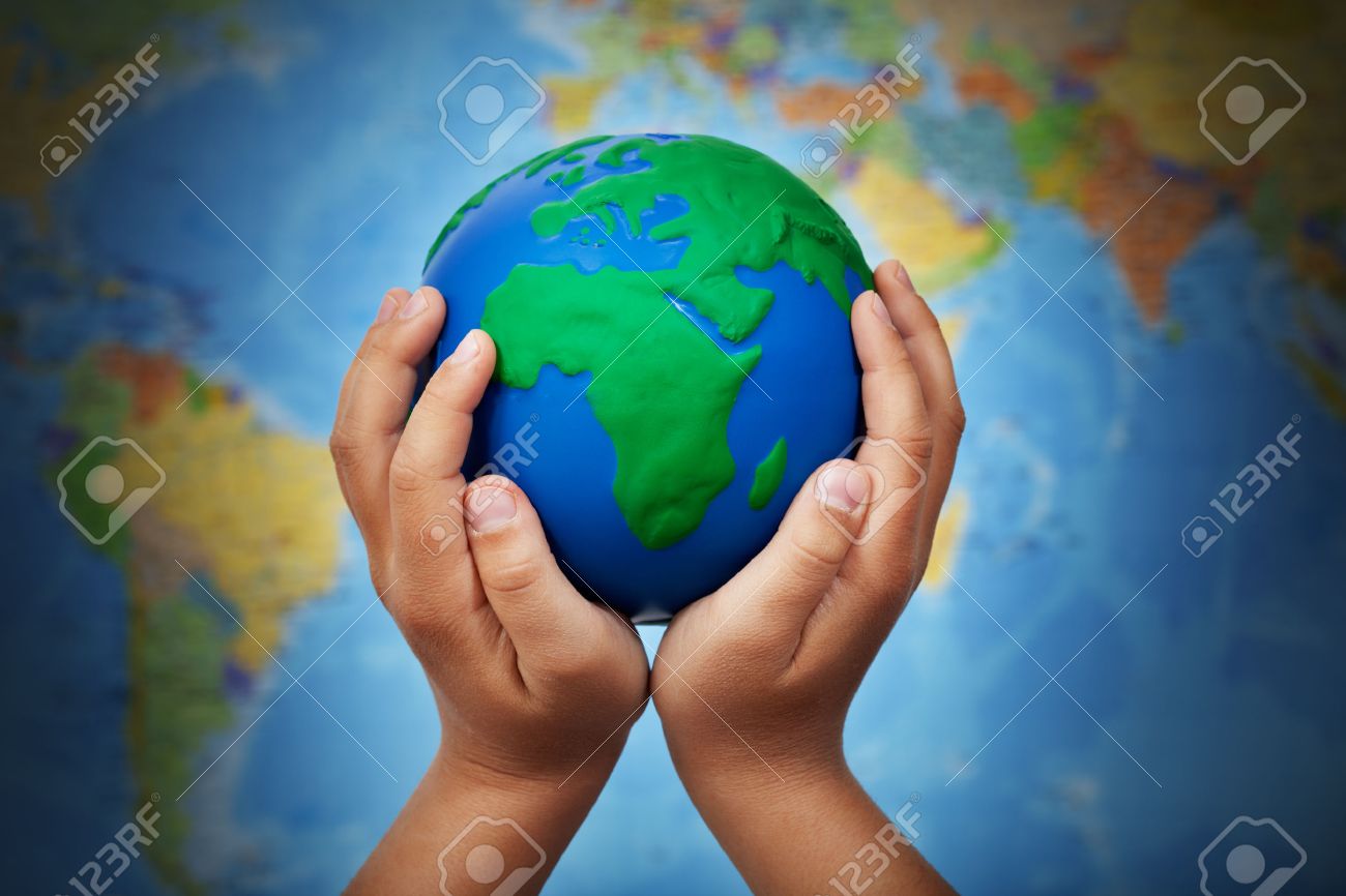 Ecology concept with earth globe in child hands against blurry world map - 39552202 Ecology concept with earth globe in child hands against blurry world map - 39552202