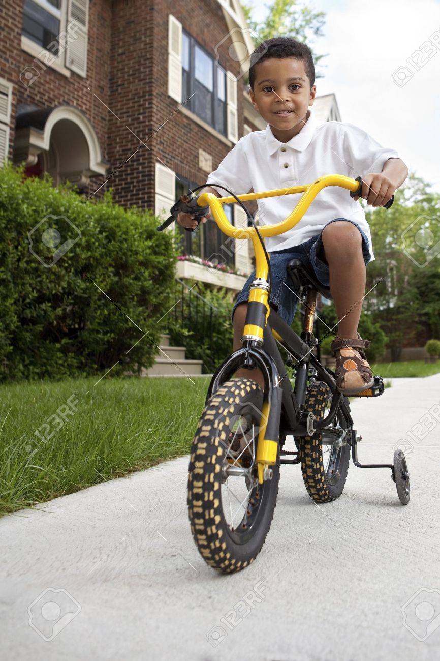 riding a bike with training wheels