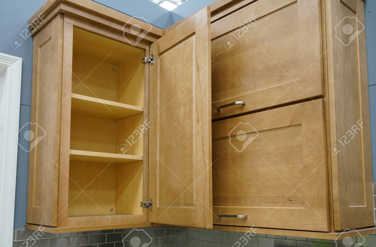 Wood Kitchen Cabinet With Door Open Stock Photo