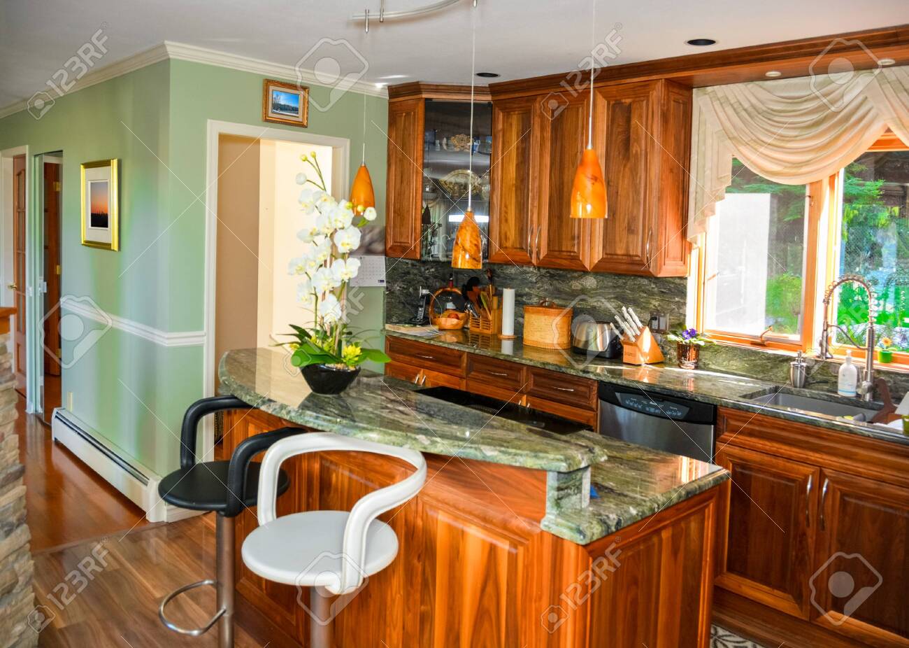 Stylish Kitchen Wooden Interior With Island Table With Two Chairs Stock Photo Picture And Royalty Free Image Image 133170594