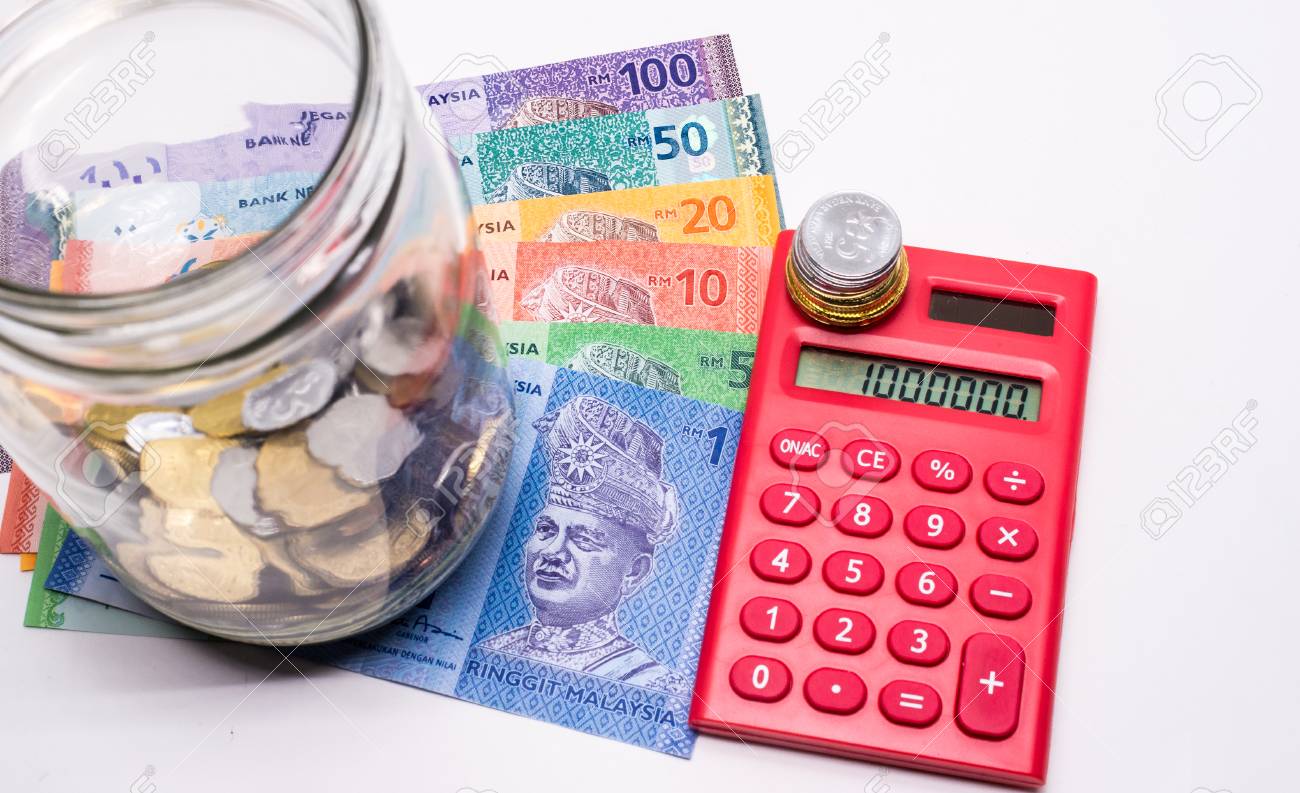 Jar Of Malaysia Coins Ringgit Banknotes Red Calculator White Background Savings Concept Shallow Depth Of Field Stock Photo Picture And Royalty Free Image Image 83756769