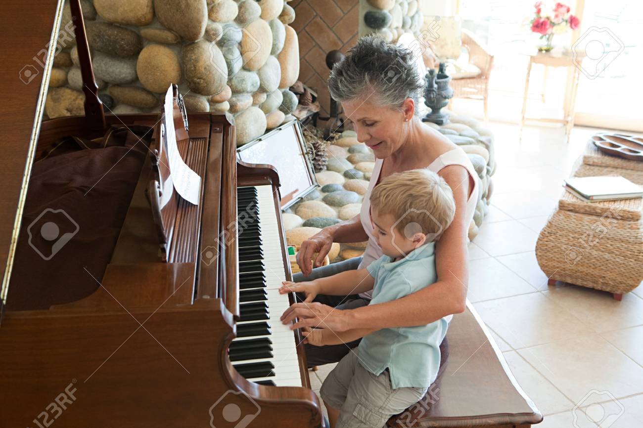 Grandmother and grandson playing the piano - 86036680 Grandmother and grandson playing the piano - 86036680