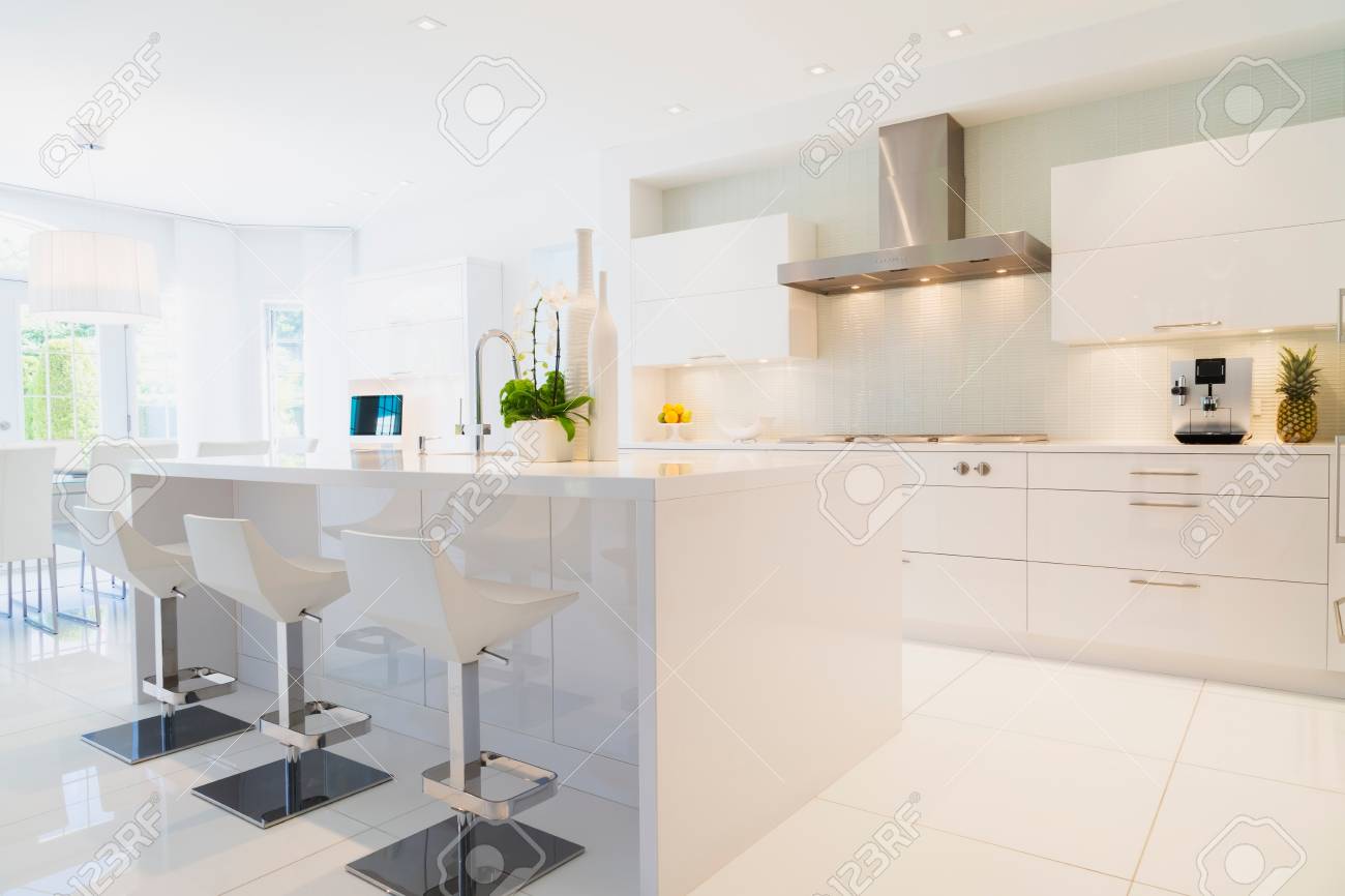 Gray Kitchen Island With Chrome And Leather Stools Transitional