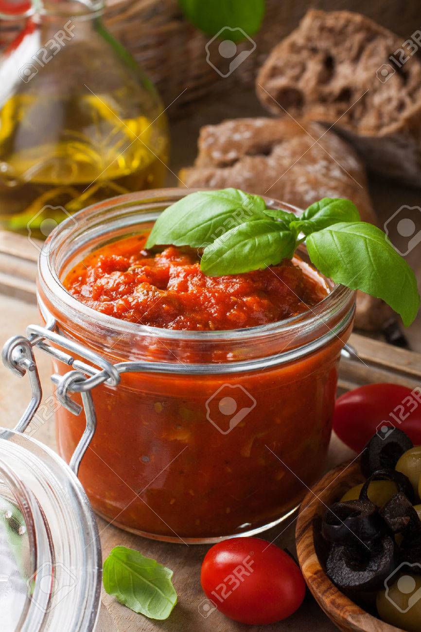 glass jar with homemade classic spicy tomato pasta or pizza sauce
