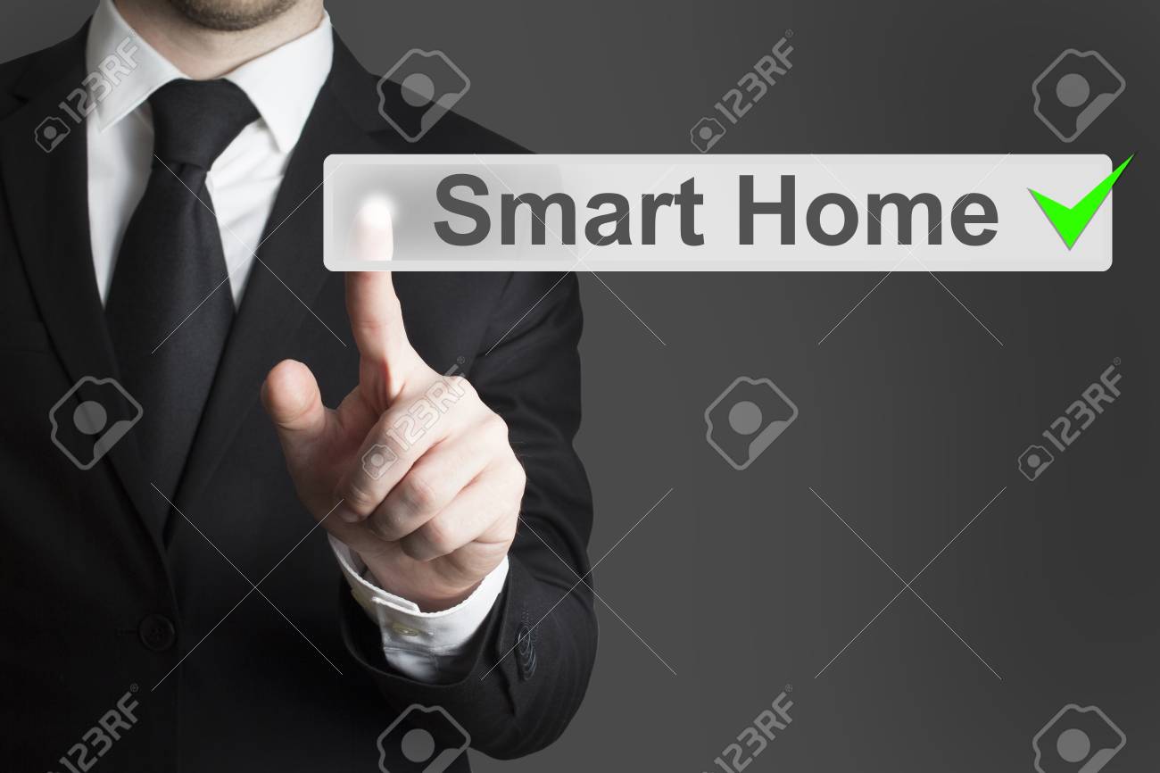 businessman in black suit pushing flat button smart home automation - 32615180 businessman in black suit pushing flat button smart home automation - 32615180