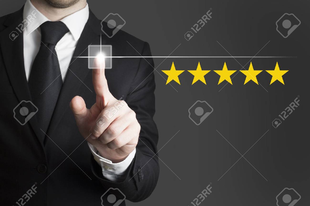 businessman in black suit pushing button five star rating - 34702585 businessman in black suit pushing button five star rating - 34702585