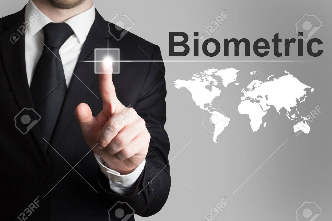 businessman in black suit pushing button biometric worldmap - 35972108 businessman in black suit pushing button biometric worldmap - 35972108