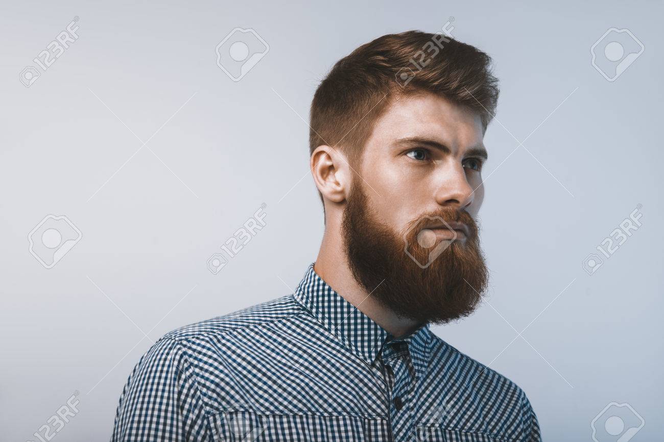 髭の男は 自信を持って楽しみ 白い背景で撮影スタジオ の写真素材 画像素材 Image